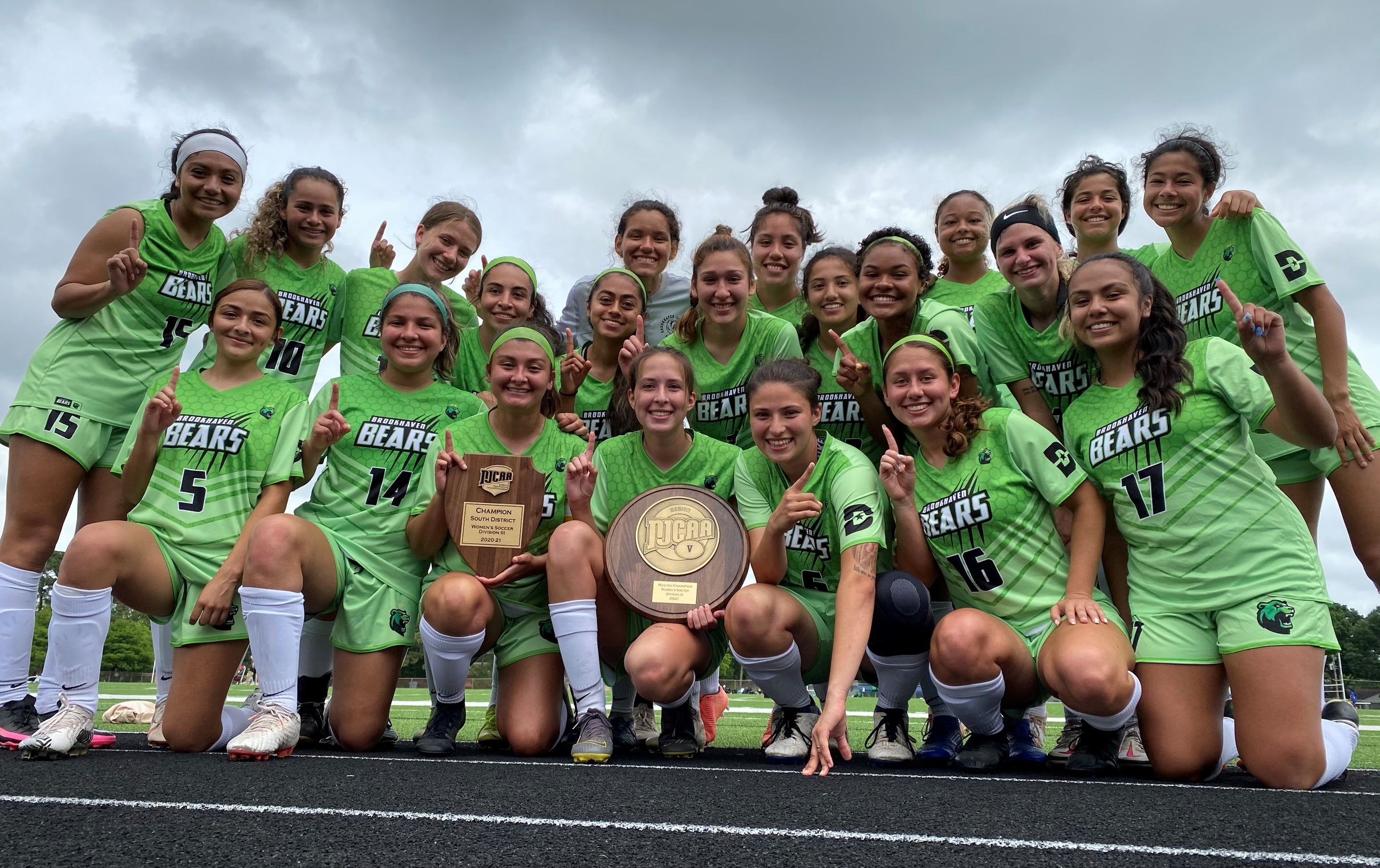 This is a picture of the Spring 2021 Brookhaven Women's Soccer Team posing with the District Championship plaques. 